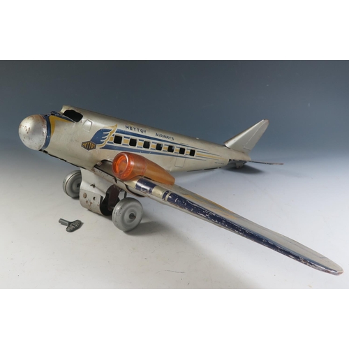 82 - A Scarce Mettoy Clockwork Tinplate Airliner Series, circa 1935 (52cm approx wingspan). DC3 Airliner ... 