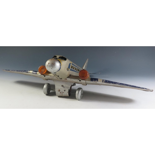 82 - A Scarce Mettoy Clockwork Tinplate Airliner Series, circa 1935 (52cm approx wingspan). DC3 Airliner ... 