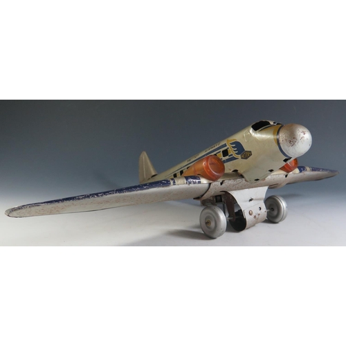 82 - A Scarce Mettoy Clockwork Tinplate Airliner Series, circa 1935 (52cm approx wingspan). DC3 Airliner ... 