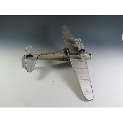 82 - A Scarce Mettoy Clockwork Tinplate Airliner Series, circa 1935 (52cm approx wingspan). DC3 Airliner ... 