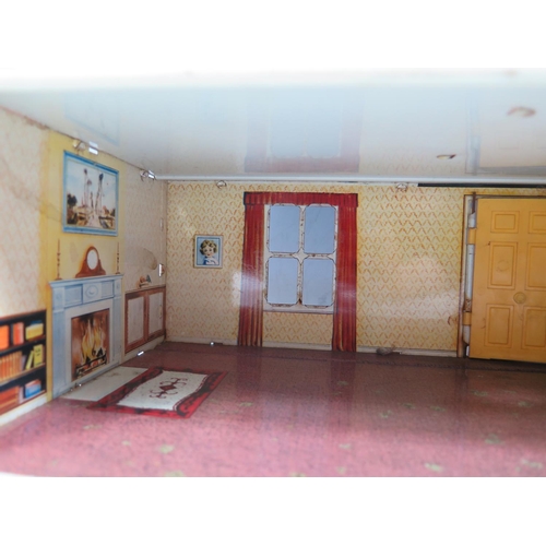 82b - A Mettoy Tinplate Dolls House with Living Room, Kitchen, 2 Bedrooms  and a Bathroom. (approx 48.5x22... 