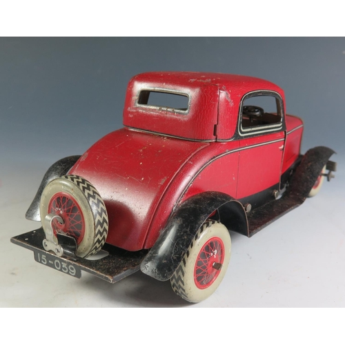 84 - A Chad Valley Ubuilda Clockwork Tinplate Burnett 2 Door Coupe Car in red and black (25.5cm approx) w... 