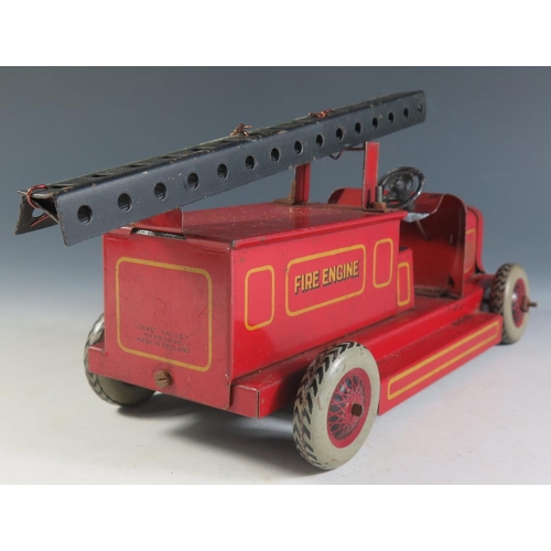 86 - A Chad Valley Ubuilda Tinplate Fire Engine (21cm approx), motor works.