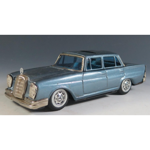 92 - A Scarce Tinplate Bandai Mercedes Benz 230 in Light Metallic Blue Made in Japan (21cm approx).