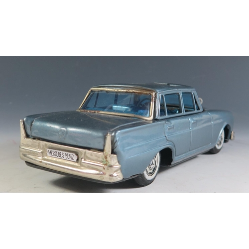 92 - A Scarce Tinplate Bandai Mercedes Benz 230 in Light Metallic Blue Made in Japan (21cm approx).