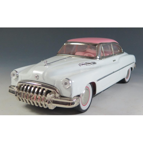 95 - Ichicko Tinplate possibly based on a Buick Roadmaster in white and pink made in Japan (27.5cm approx... 