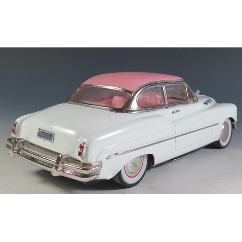 95 - Ichicko Tinplate possibly based on a Buick Roadmaster in white and pink made in Japan (27.5cm approx... 