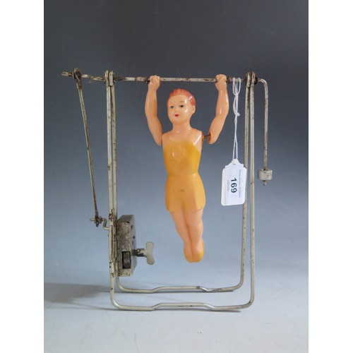 169 - A 1950's Russian Made Clockwork Celluloid Gymnast in Working Condition (frame measures 22.5cm approx... 