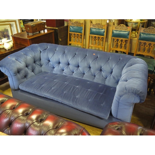 553 - A Three Seater Chesterfield in blue dralon upholstery