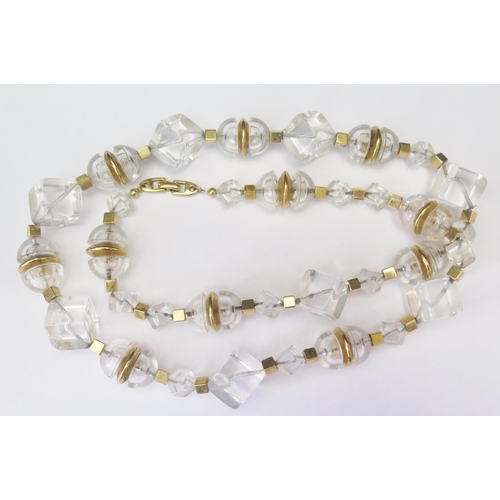 491A - An Art Deco Style Clear Plastic Bead Necklace by NAPIER, 79cm