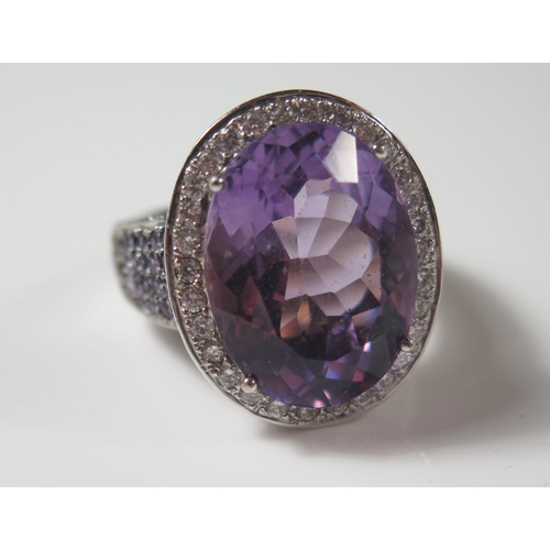 493 - An 18ct White Gold Amethyst and Diamond Dress Ring, size R.5, 19.3g, central stone 20x15mm