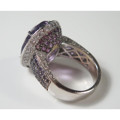 493 - An 18ct White Gold Amethyst and Diamond Dress Ring, size R.5, 19.3g, central stone 20x15mm