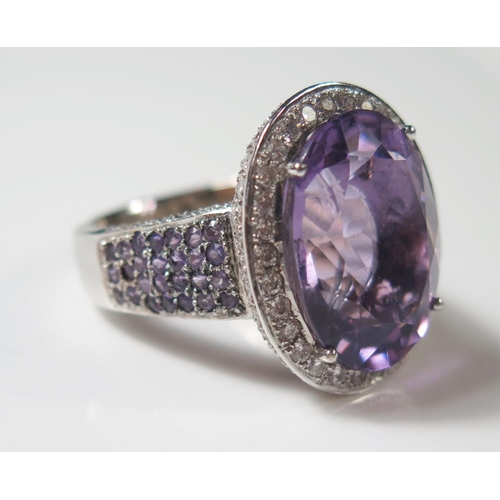 493 - An 18ct White Gold Amethyst and Diamond Dress Ring, size R.5, 19.3g, central stone 20x15mm