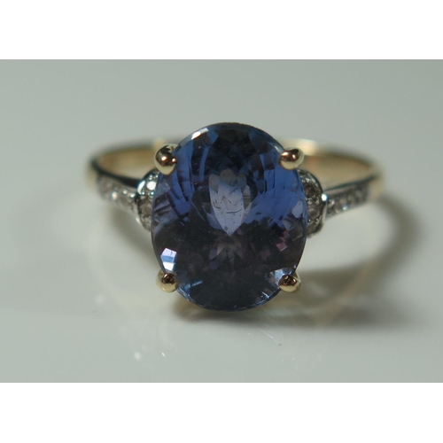 495 - A 14K Yellow Gold, Tanzanite and Diamond Ring, size N, 3.3g, central stone 11x9mm