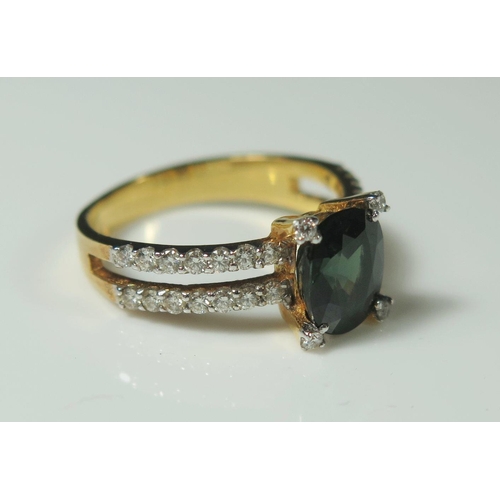 502 - A Green Sapphire and Diamond Ring in an unmarked gold setting, size M, 3.4g. (phone bid in 10x2)