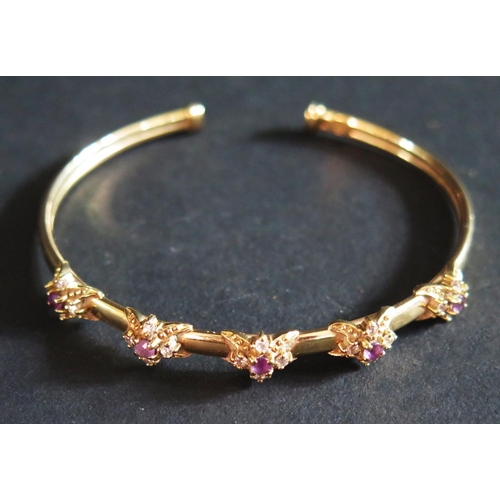 506 - A 9ct Gold, Amethyst and Diamond Bangle, 9g. (Phone Bid)