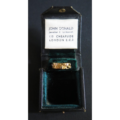 512 - A John Donald Yellow and White Gold Band in original box, size J, 4g, stamped with maker mark only. ... 