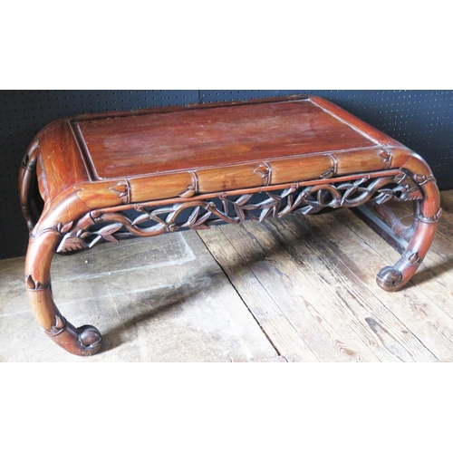 539 - A Chinese Rosewood Coffee Table with naturalistic carved bamboo edges and carved and pierced apron, ... 