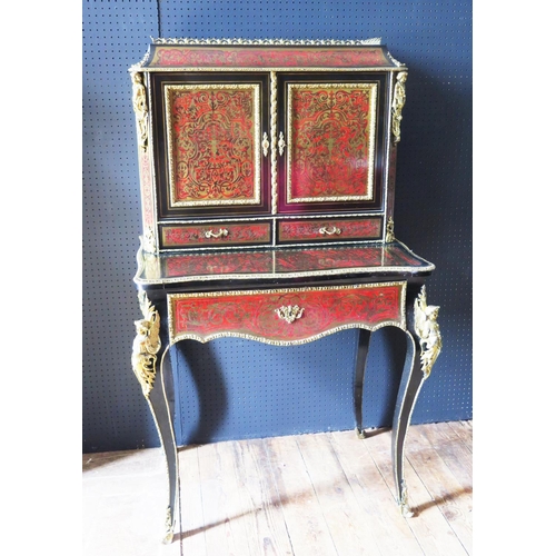 548 - A 19th Century French Boulle Bonheur du Jour with cabriole legs mounted with gilt angels to the shou... 