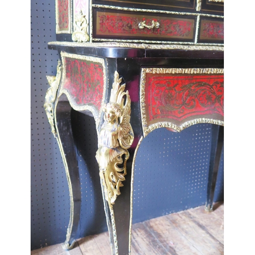 548 - A 19th Century French Boulle Bonheur du Jour with cabriole legs mounted with gilt angels to the shou... 