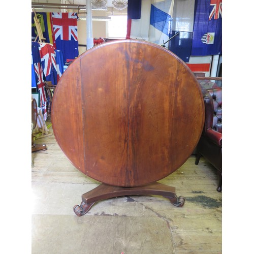 546A - A Victorian Mahogany Tilt Top Circular Dining Table with a tripod base and scroll/lion claw feet.
di... 