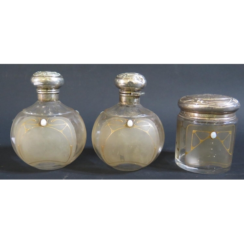 125 - A Pair of Edward VII Art Nouveau Scent Bottles with slice cut shoulders over three frosted glass pan... 