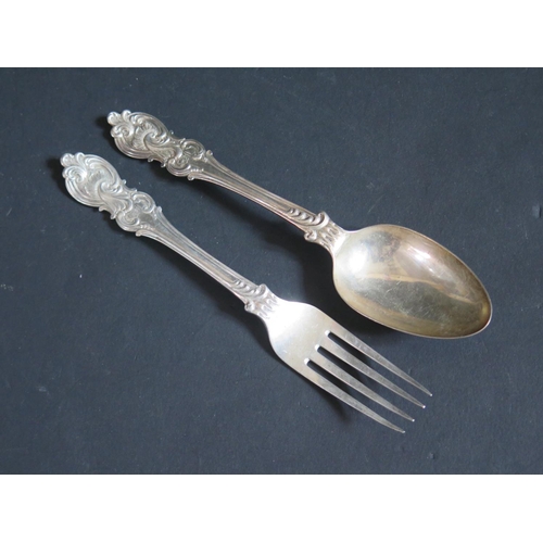 129 - A Victorian Silver Desert Spoon and Fork, the back of the spoon bowl with chased foliate scroll deco... 