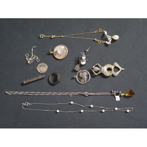 154 - A Box of Odd Costume Jewellery including an early steel football pendant, risqué cigar cutter etc.