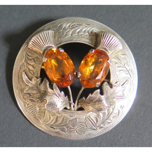 168 - An Early Elizabeth II Scottish Silver and Citrine Mounted Thistle Brooch with chased decoration, Gla... 