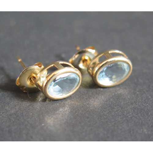 208 - A Pair of 9ct Gold and Topaz Earrings, 1.5g