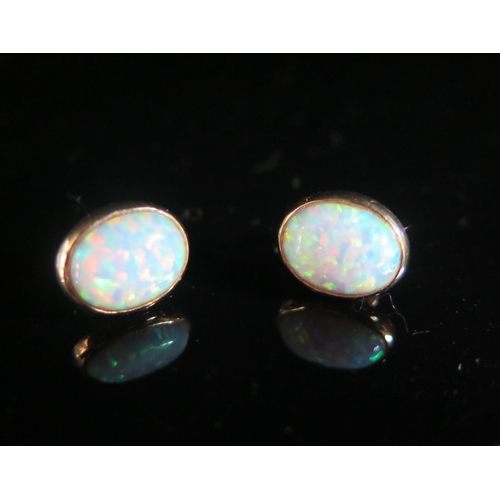 209 - A Pair of 9ct Gold and Singlet Opal Earrings, 1.5g