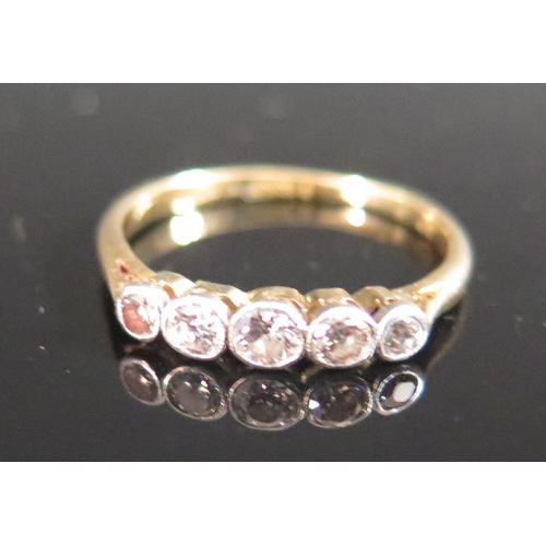 220B - A Diamond Five Stone Ring in an 18ct and Platinum Setting, size L.5, 2g