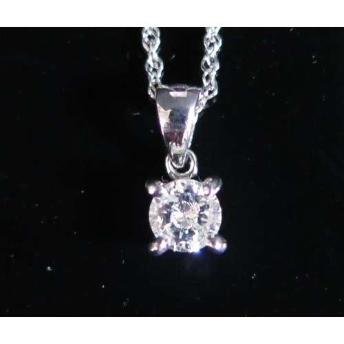 220C - An 18ct White Gold Solitaire Diamond Pendant on a 9ct gold chain, 1.9g