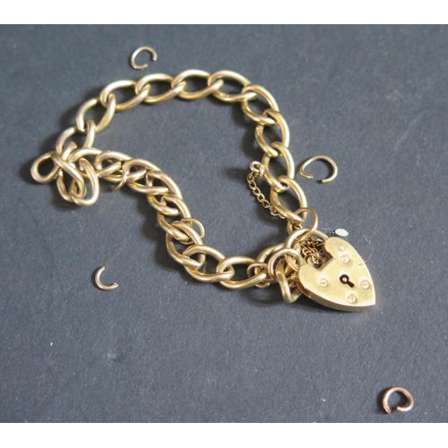 220I - A 9ct Gold Curb Link Bracelet with heart clasp, 15.6g