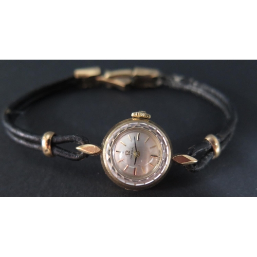 225B - A Lady's Omega 9ct Gold Wristwatch with leather strap and 9ct clasp, movement no. 19561698, running