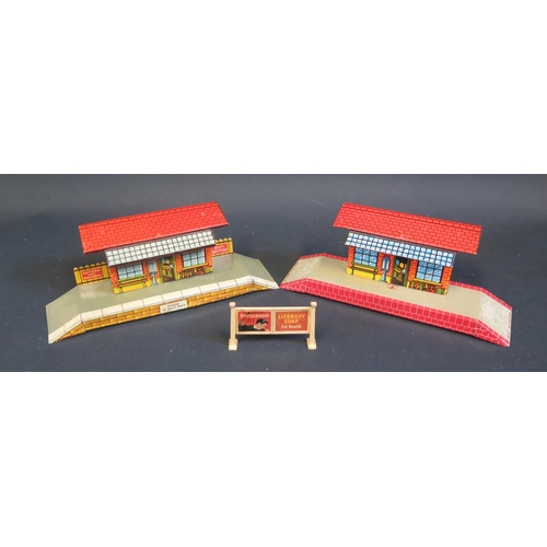 268 - Two English Made Tinplate Platform Train Stations (24cm approx.) and one Hornby advertising sign.