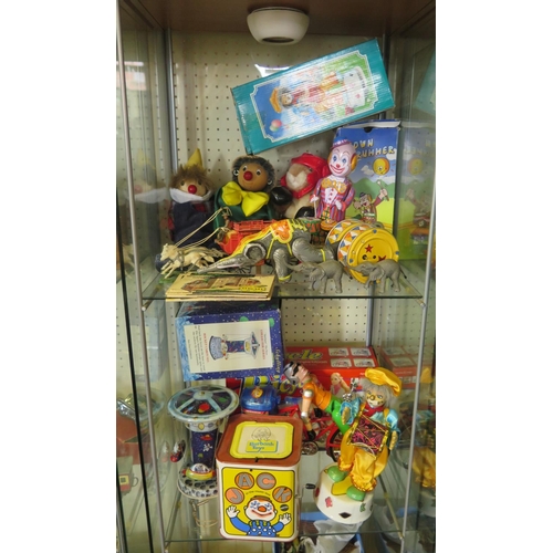 269 - A Collection of Tinplate Models, Puppets etc. (two shelves).