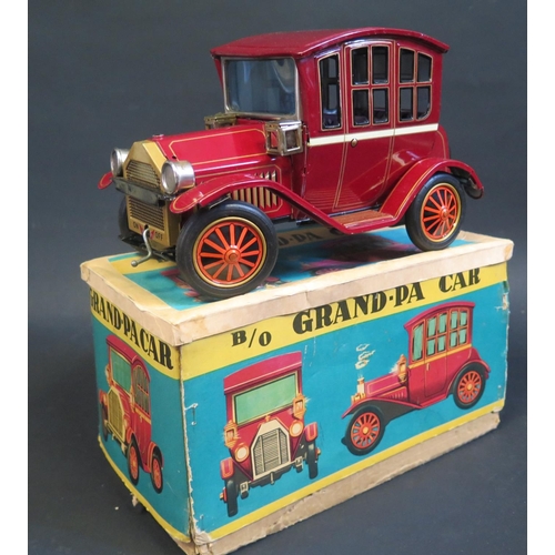 284 - A TN Nomura Japan Battery Operated Tinplate Grand-Pa Car. Excellent (untested) in worn box.