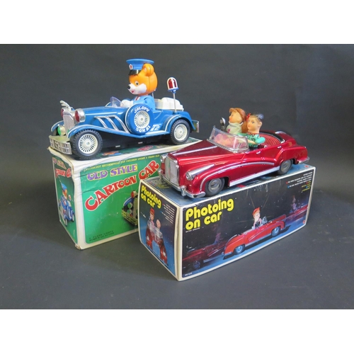 285 - A Chinese made Tintoy Battery Operated ME630 Photoing Car and 'Old Style' Plastic Cartoon Car. Both ... 