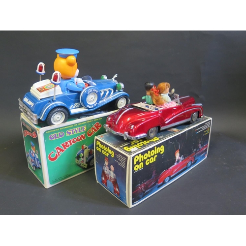 285 - A Chinese made Tintoy Battery Operated ME630 Photoing Car and 'Old Style' Plastic Cartoon Car. Both ... 