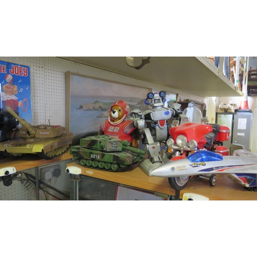 288 - Seven Battery Operated Toy Tanks, Airplane, Bike etc.