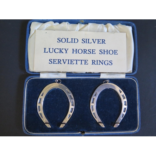 57 - A Cased Pair of Sheffield Silver Lucky Horse Shoe Serviette Rings, H. Hunt, 67g