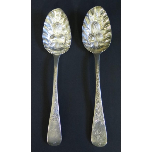 75 - A Pair of George IV Silver Berry Spoons engraved with period griffin terminals and chased foliate de... 