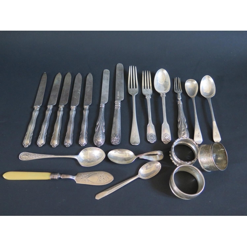 86 - A Selection of Victorian and later Silver including flatware, napkin rings, ivory handle silver butt... 