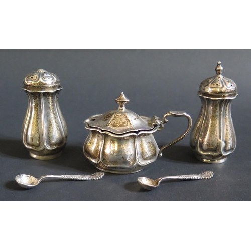 96 - An Edward VII Silver Three Part Cruet, Sheffield 1904, Atkin Bros. and two salt spoons, 103g