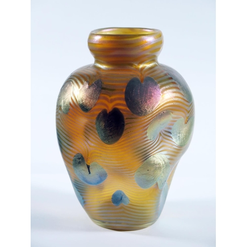 159 - A Loetz Iridescent Glass Vase decorated with wavy horizontal lines and lily pads on dimple shaped bo... 