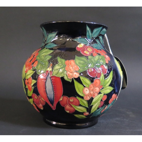 29 - A Modern Moorcroft Limited Edition Candle and Berry Decorated Vase 2003, 19/50, 14.5cm, boxed, cost ... 