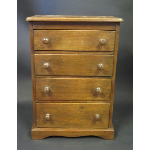 751 - A Table Top Chest of Four Drawers, 42(h)x29(w)x16(d)cm