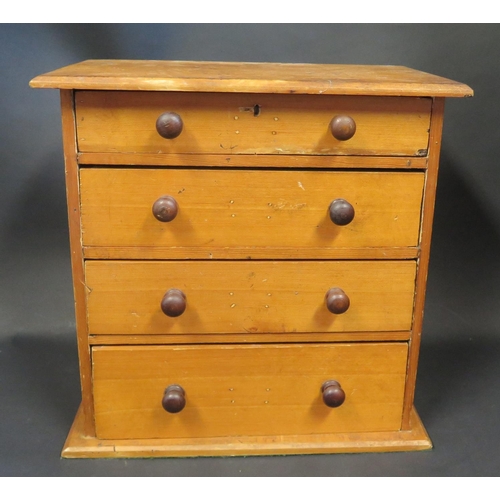 752 - A Table Top Chest of Four Drawers, 36.5(h)x36.5(w)x22(d) cm