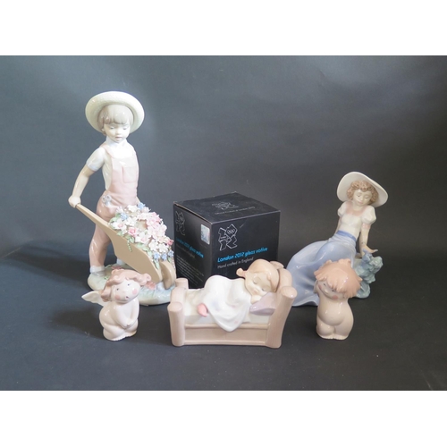 739 - A Lladro Figurine, Four Boxed Nao Figurines and London 2012 Glass Votive